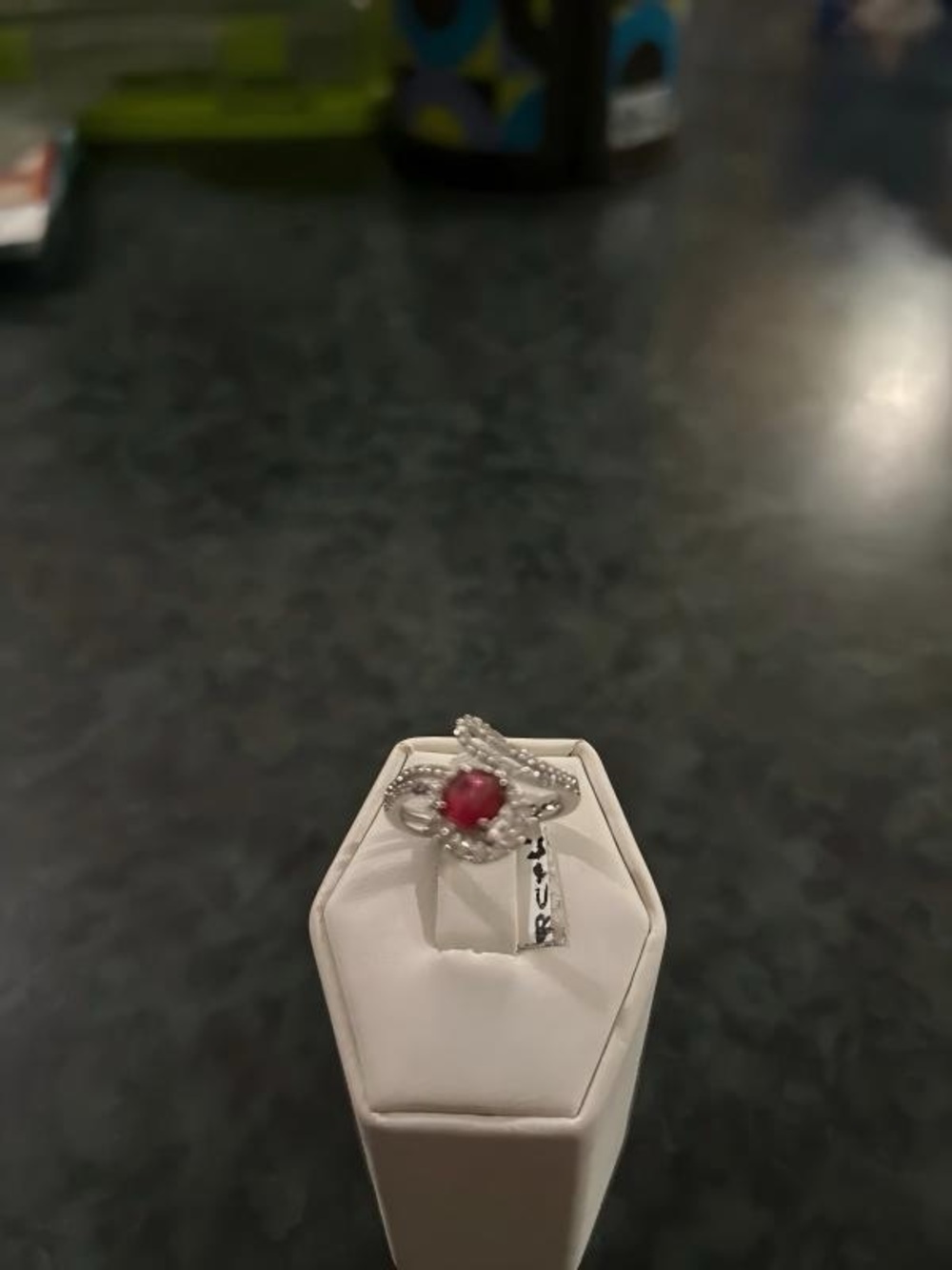 Sterling Silver Ring with Red Center Stone and Twisted Halo